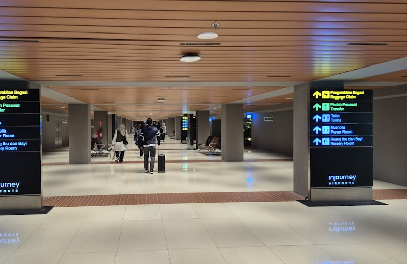 Arrivals hall of an airport terminal with direction signs